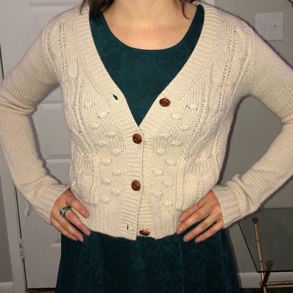 Cream colored cable knit cardigan